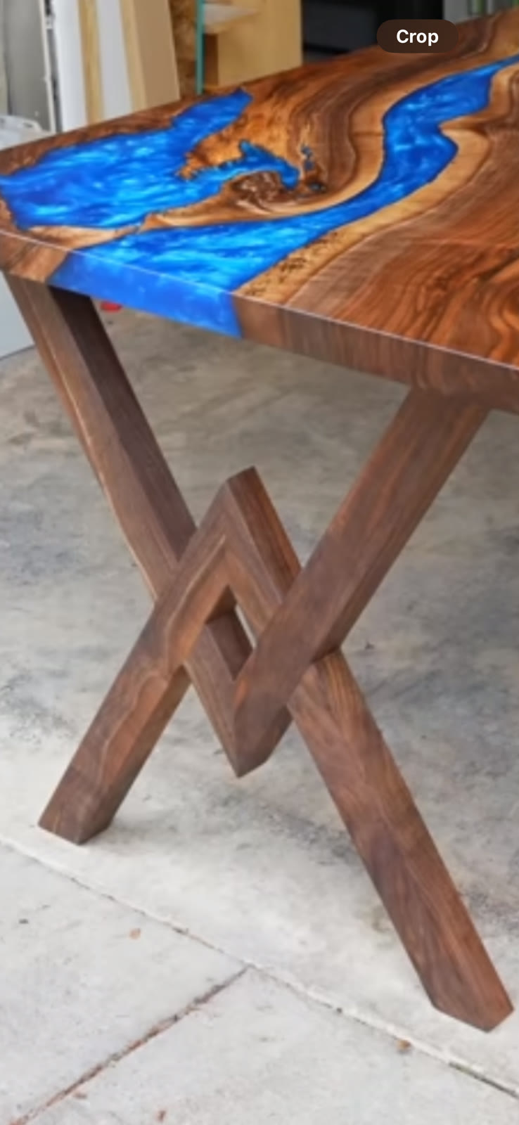 Custom walnut epoxy river coffee table with X-frame legs